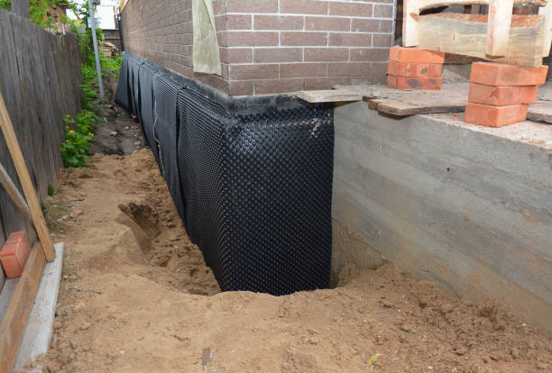 SJ Waterproofing Pros technician performing targeted Exterior Waterproofing assessment in Malcolm, AL